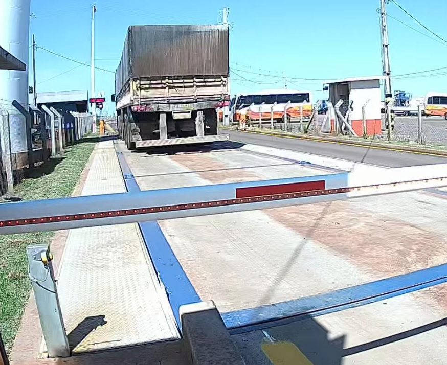 Truck on the weighbridge with the barrier in front